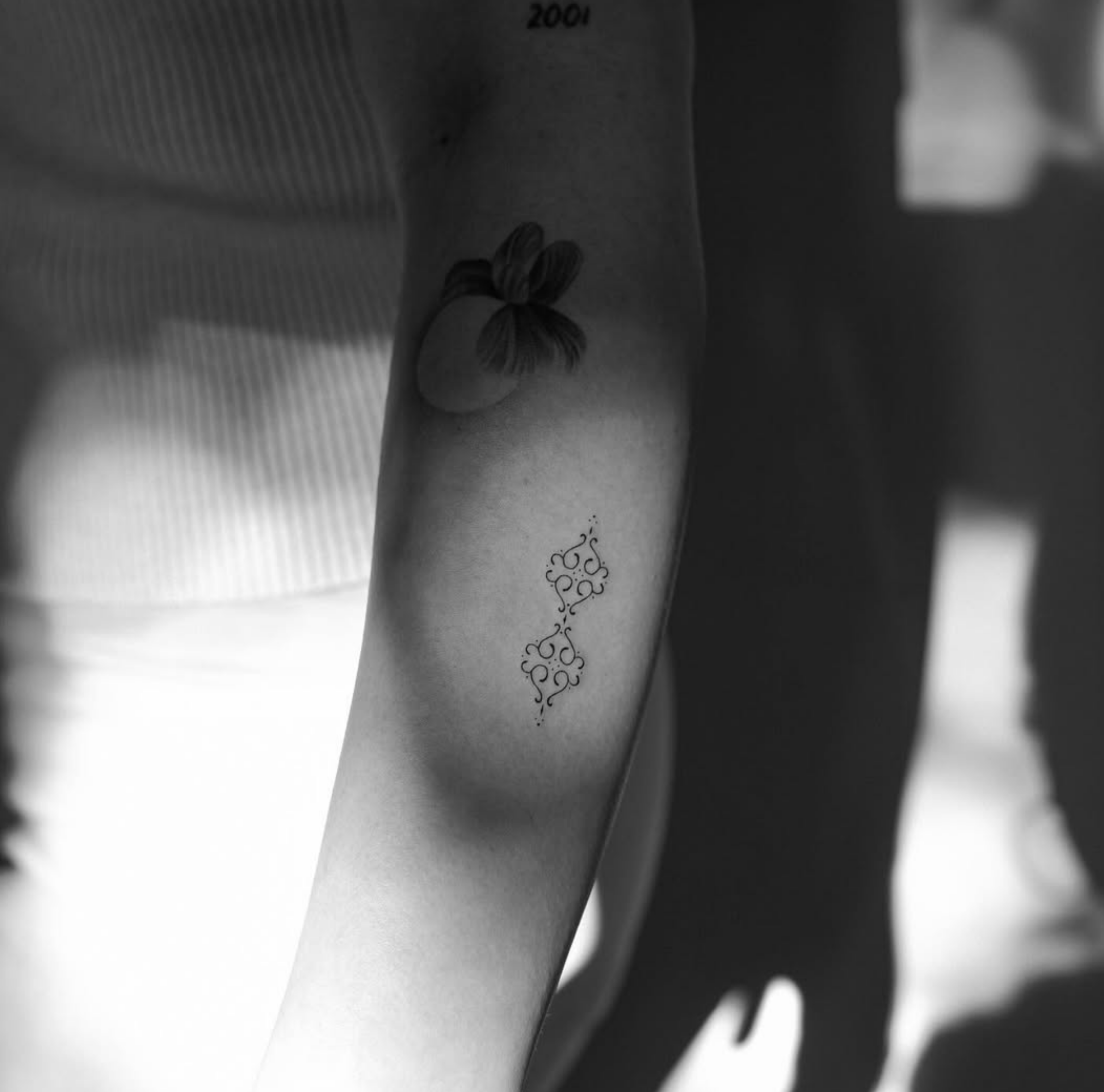 famous people fine line tattoos